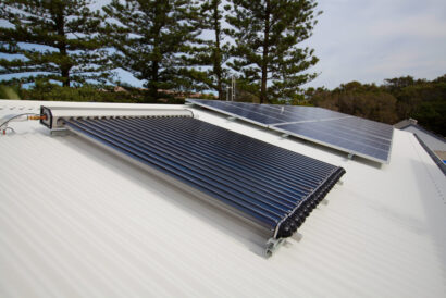 Solar panels and solar hot water on house woof