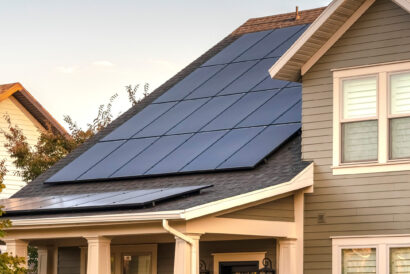 Panorama frame Solar photovoltaic panels on a house roof. Solar photovoltaic panels on a house roof for providing sustainable alternative energy from natural resources